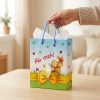 Bolsa de regalo de Pascua con conejo preparada para entregar, con papel de seda decorativo no incluido.