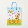 Bolsa de regalo de Pascua extendida con asas azules y tarjeta a juego.