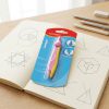 Compás escolar KEYROAD en su blíster sobre un cuaderno con dibujos geométricos