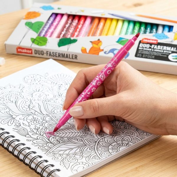 Mano coloreando un dibujo con un rotulador rosa Maker de doble punta