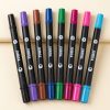 Ocho rotuladores YUWEI Amazcolor de doble punta con cuerpo negro y capuchones de distintos colores.