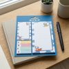 Set de notas KITE con perritos colocado sobre un cuaderno en un escritorio