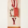 Bolsa de regalo navideña para botella JOY con asas rojas y base de cuadros