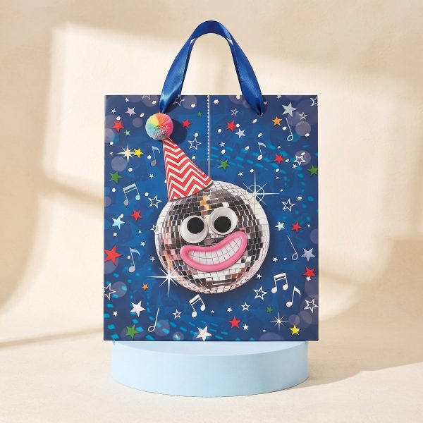 Bolsa de regalo con bola de discoteca sobre pedestal azul
