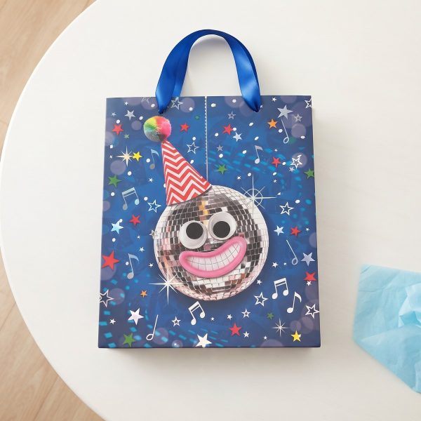 Vista cenital de bolsa de regalo azul con estrellas y notas musicales