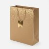 Bolsa de regalo kraft con lunares dorados, vista lateral