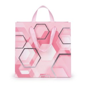Bolsa de regalo rosa con hexágonos plateados y asas de cinta rosa