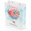 Bolsa de regalo con globo floral y asas rosas, vista lateral