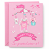 Tarjeta Its a Baby Girl rosa Tarjeta rosa It's a Baby Girl con móvil infantil y lazo