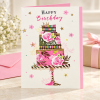 Tarjeta de cumpleaños Tarta floral junto a un regalo